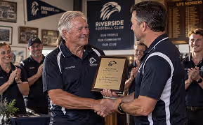Long-serving sports club volunteer receiving recognition